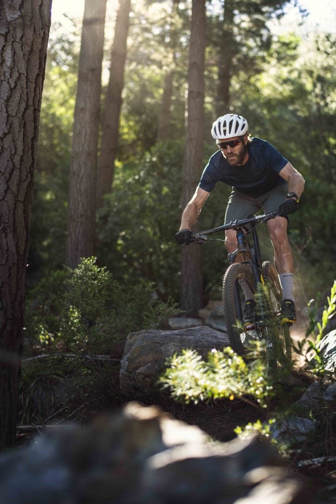 Suunto7 Father biking forest downhill Suunto Tackles Tough OZ Smartwatch market